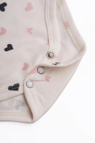 Half sleeve heart pattern in cream bodysuit  for baby
